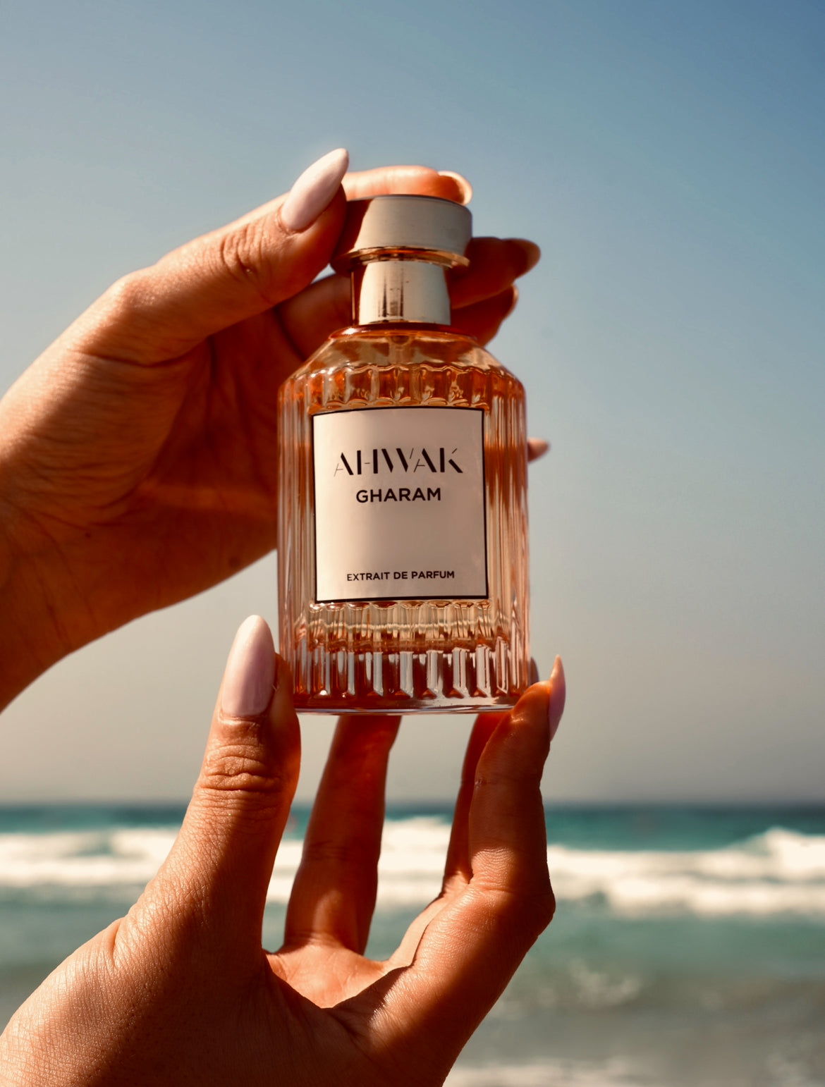 Gharam Perfume held up on the beach